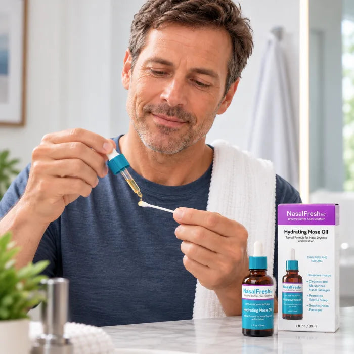 Hydrating Nose Oil applied to a cotton swab, with the bottle and carton on the counter